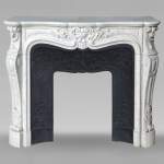 Carved Carrara marble Louis XV style mantel with shell and flower design