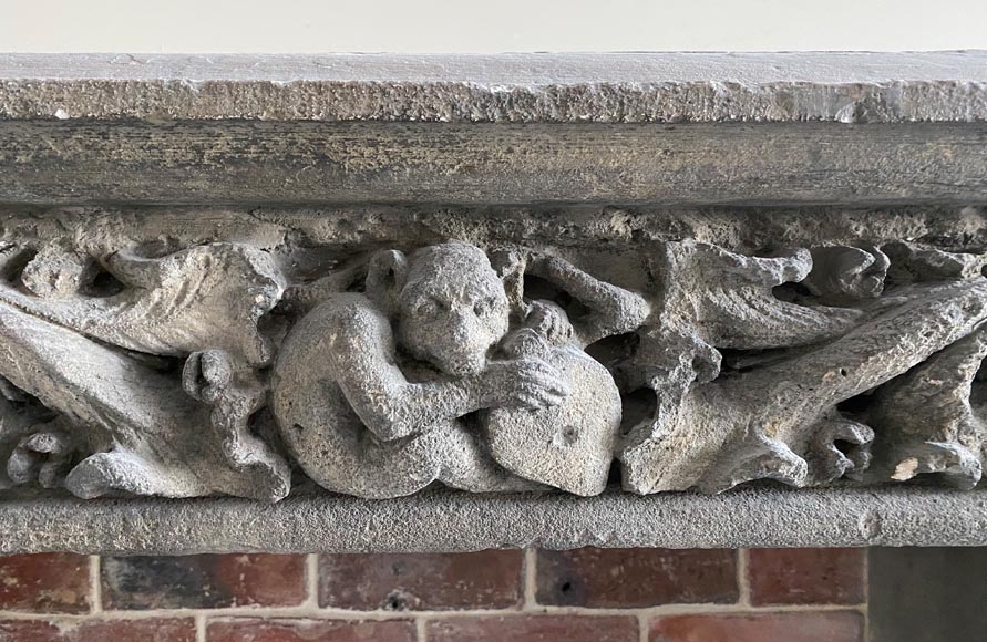 Gothic period stone mantelpiece with monsters and carved capitals-1