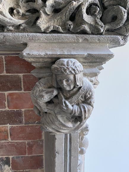 Gothic period stone mantelpiece with monsters and carved capitals-10