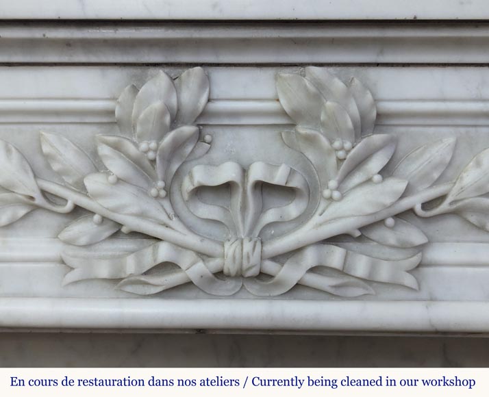 Louis XVI style Carrara marble mantel adorned with a laurel wreath-2