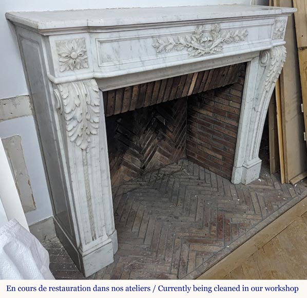 Louis XVI style Carrara marble mantel adorned with a laurel wreath-5