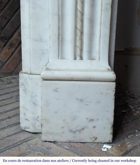 Louis XVI style Carrara marble mantel adorned with a laurel wreath-12