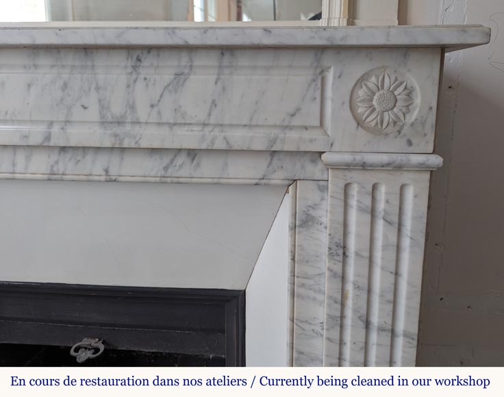 Louis XVI style mantel in veined Carrara marble with flower adorned heads-6