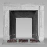 Louis XVI style mantel in Carrara marble adorned with a sunflower