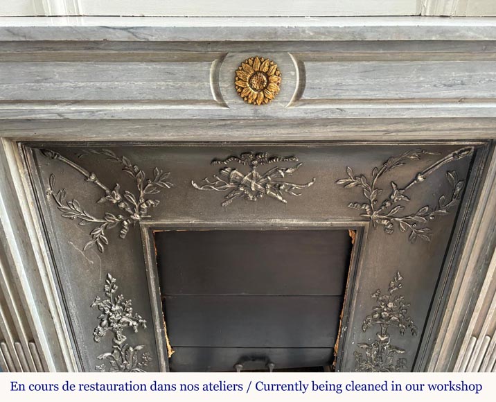 Louis XVI style mantel in light blue Turquin marble decorated with bronze sunflowers-1