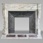 Louis XVI style Arabescato marble mantel with curved entablature decorated with a laurel wreath