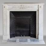 Louis XVI style Carrara marble mantel decorated with a laurel wreath