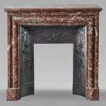 Louis XIV style mantel in Rouge du Nord marble