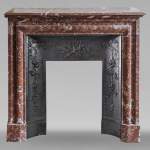 Louis XIV style mantel in Rouge du Nord marble