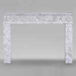 Louis XVI period mantel adorned with a garland carved in antique veined Carrara marble