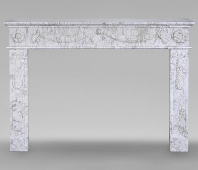 Louis XVI period mantel adorned with a garland carved in antique veined Carrara marble-0