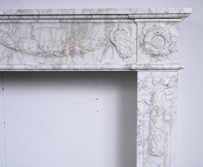 Louis XVI period mantel adorned with a garland carved in antique veined Carrara marble-10