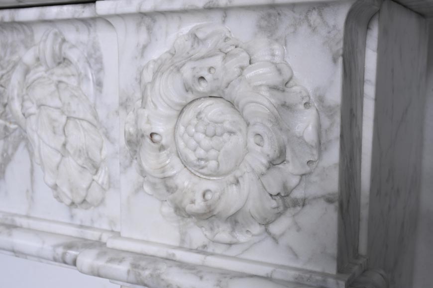 Louis XVI period mantel adorned with a garland carved in antique veined Carrara marble-11