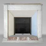 Louis XVI style mantel in veined Carrara marble with fluted legs