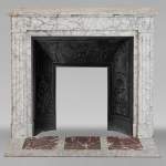 Louis XVI style molded mantel in highly veined Carrara marble