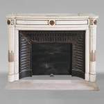 Louis XVI style curved mantel with half columns carved in half statuary marble with bronze décor