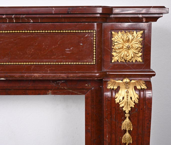 Louis XVI style fireplace in Antique Red marble, with bronze mounts, decorated with a garland-10