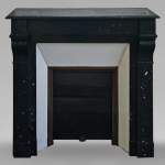 Napoleon III style mantel with black speckled marble modillions