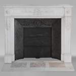 Louis XVI style mantel with laurel wreath carved in semi-statuary marble