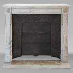 Louis XVI style mantel with pilaster feet carved in veined Carrara marble