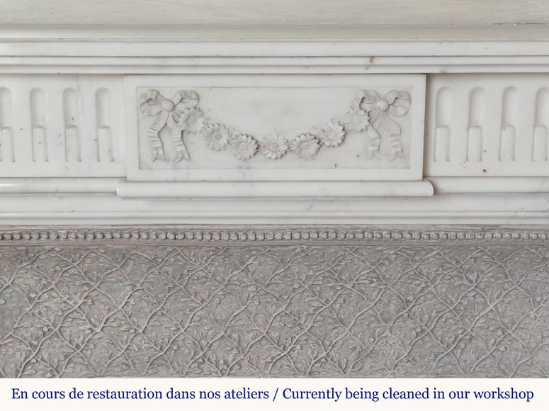 Louis XVI style semi-statuary marble mantel adorned with a frieze of flowers-1