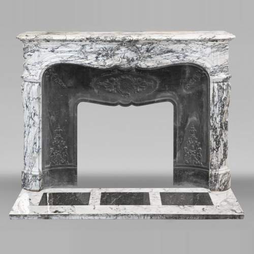 Large Louis XV style fireplace decorated with a large shell, in Seravezza marble