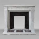 Louis XVI style fireplace in Carrara marble, decorated with rudentée fluting