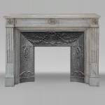 Louis XVI style fireplace in Carrare marble, decorated with floral fluting