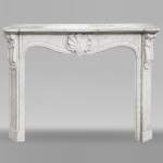 Louis XV style fireplace in Carrara marble decorated with a shell