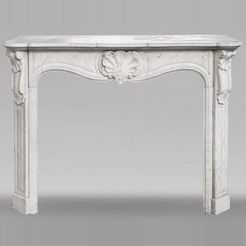 Louis XV style fireplace in Carrara marble decorated with a shell