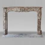 Louis XV period fireplace in Royal Red, decorated with a palmette