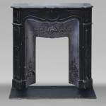 Small Louis XV style fireplace, Pompadour model, in speckled black marble