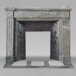 Louis XVI style fireplace with molded decoration, in green Campan marble