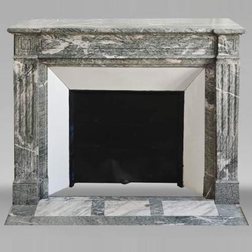 Louis XVI style fireplace molded in white-veined green Campan marble