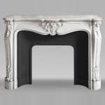 Louis XV style fireplace in Carrara marble, decorated with a palmette