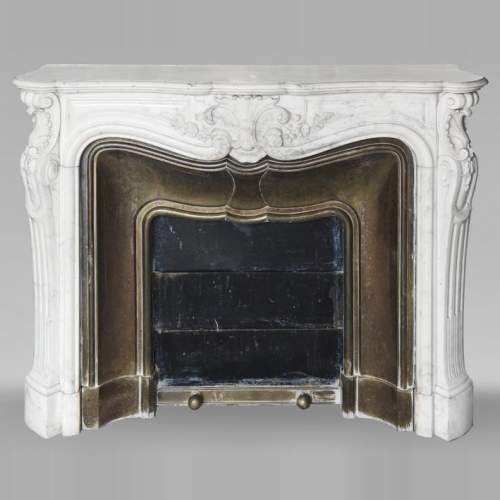 Louis XV style fireplace decorated with a palmette