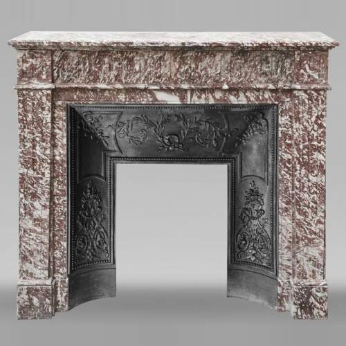 Louis XVI style fireplace decorated with fluting in pink marble