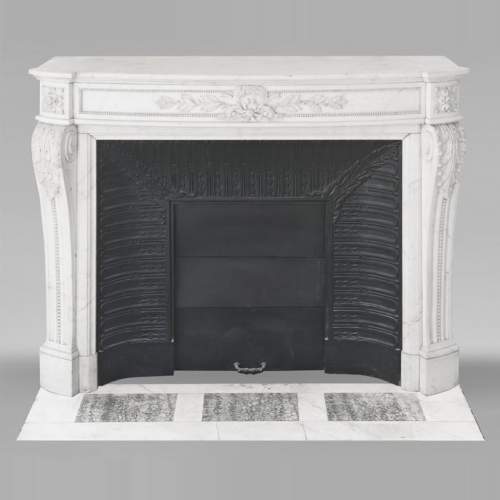 Curved Louis XVI style fireplace with beaded decoration, in semi-statuary marble.