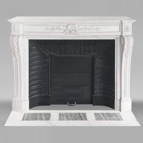Curved Louis XVI style fireplace with beaded decoration, in semi-statuary marble.