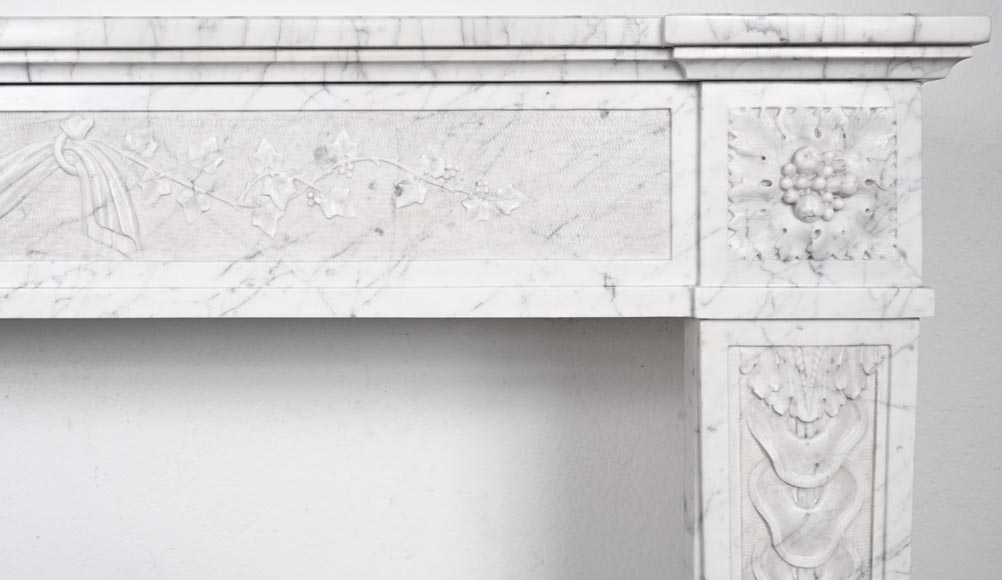 Louis XVI period fireplace with carved fruit decoration, in veined Carrara marble-11