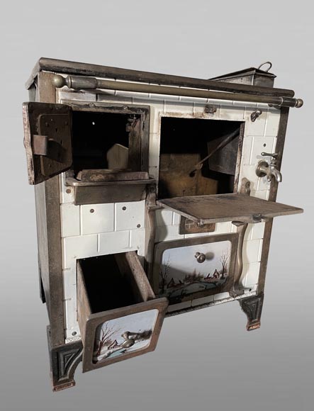 Cast-iron stove with faience imitation and snowy landscape decoration Cast-iron stove with faience imitation and snowy landscape decoration-2