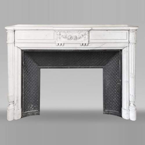 Louis XVI style fireplace with half-column and floral garland, in semi-statuary marble