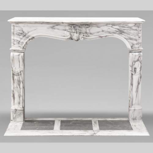 Louis XV style fireplace with asymmetrical palmette, in arabescato marble