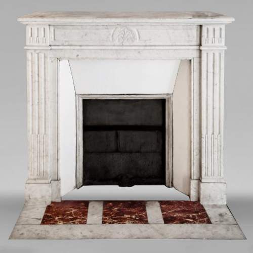 Louis XVI style fireplace in Carrara marble, decorated with a palmette