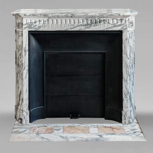 Louis XVI style fireplace with fluted decoration in Arabescato marble
