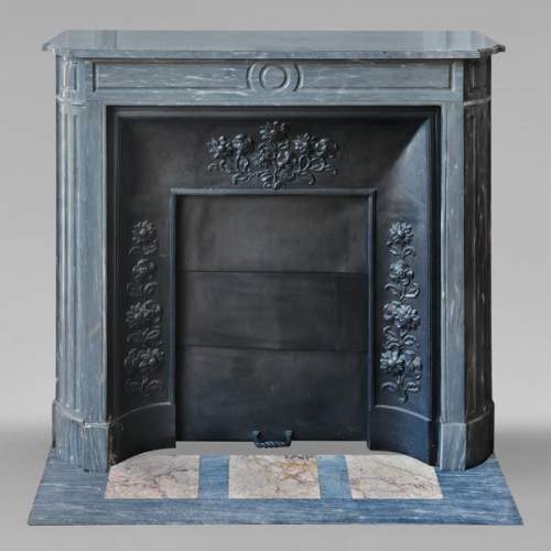 Louis XVI style fireplace with rounded corners, in blue Turquin marble