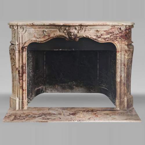 Louis XV style fireplace in highly ornate Sarrancolin marble