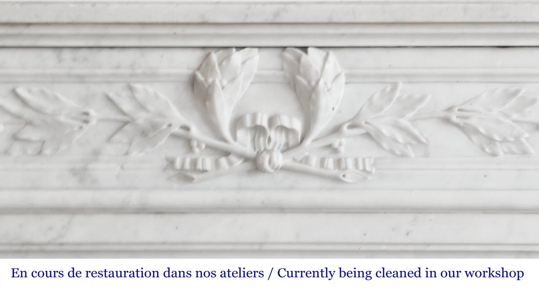 Louis XVI style fireplace with rounded corners and decorated with a laurel wreath, in Carrara marble-1