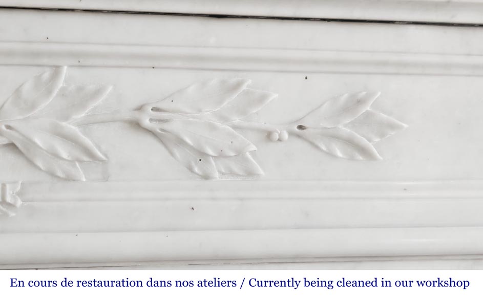 Louis XVI style fireplace with rounded corners and decorated with a laurel wreath, in Carrara marble-2