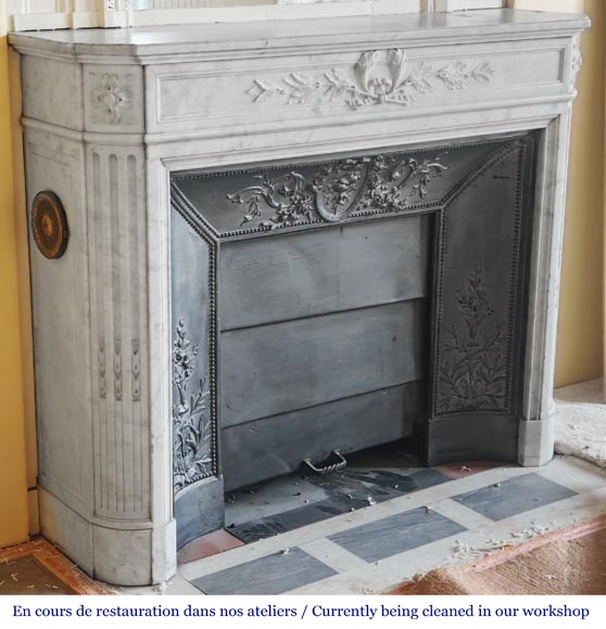 Louis XVI style fireplace with rounded corners and decorated with a laurel wreath, in Carrara marble-4